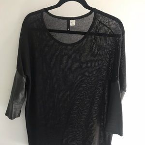 Loose knit sweater with faux leather sleeves